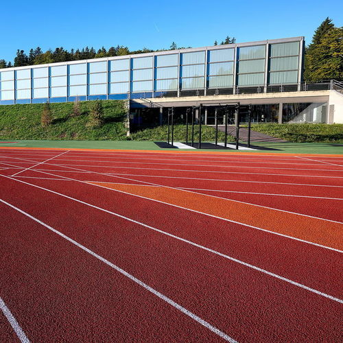 Pavimentazione sportiva da esterno - RE-TOPPING SYSTEMS - Polytan GmbH - in elastomero / in gomma / per scuola