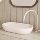 lavabo da appoggio / in calcestruzzo / finitura opaca / ovale