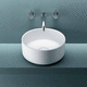 lavabo da appoggio / in Corian® / rotondo / senza foro
