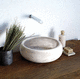 lavabo da appoggio / in pietra naturale / rotondo / contemporaneo