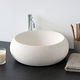 lavabo da appoggio / in pietra naturale / rotondo / contemporaneo