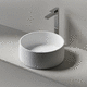 lavabo da appoggio / in pietra / rotondo / senza foro