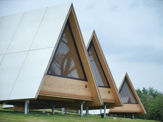 Le famiglie in Cina creano un'eco-comunità di legno, cabine con telaio ad A